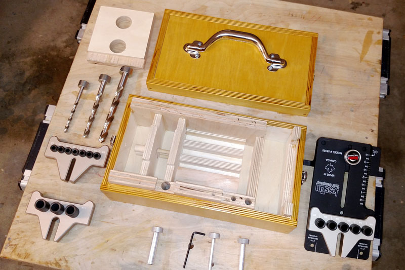 Empty Dowelling Jig Box with All Its Contents Spread Around It