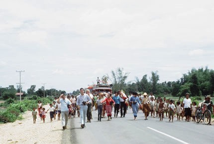 Group Walking Toward Town