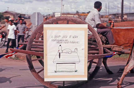 Another Ox Cart with Cartoon Sign